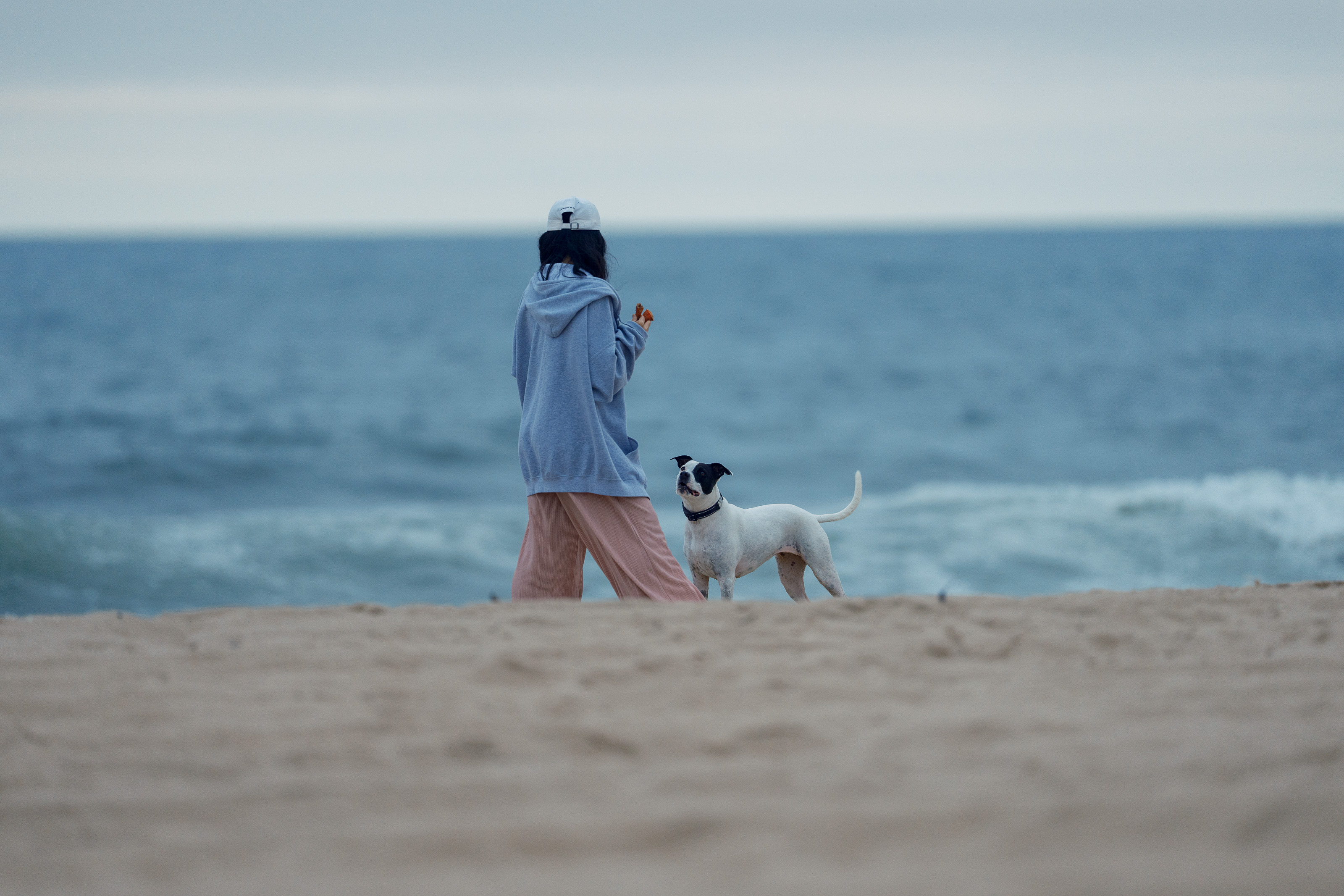 Kota and friend standing on a dune overlooking the East Hampton ocean